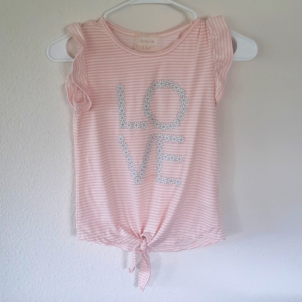 Between girl's shirt size 7